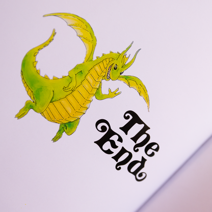 Illustration of a green dragon above 'The End' on a book page